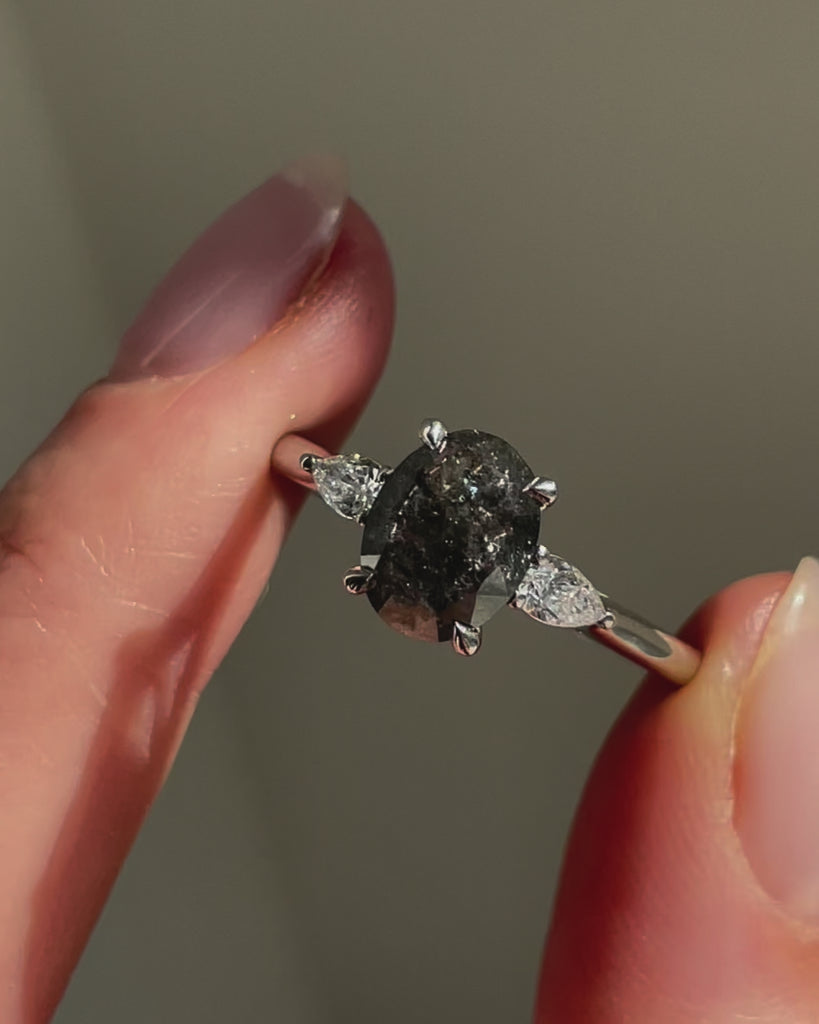 Platinum salt and pepper oval diamond engagement trilogy ring