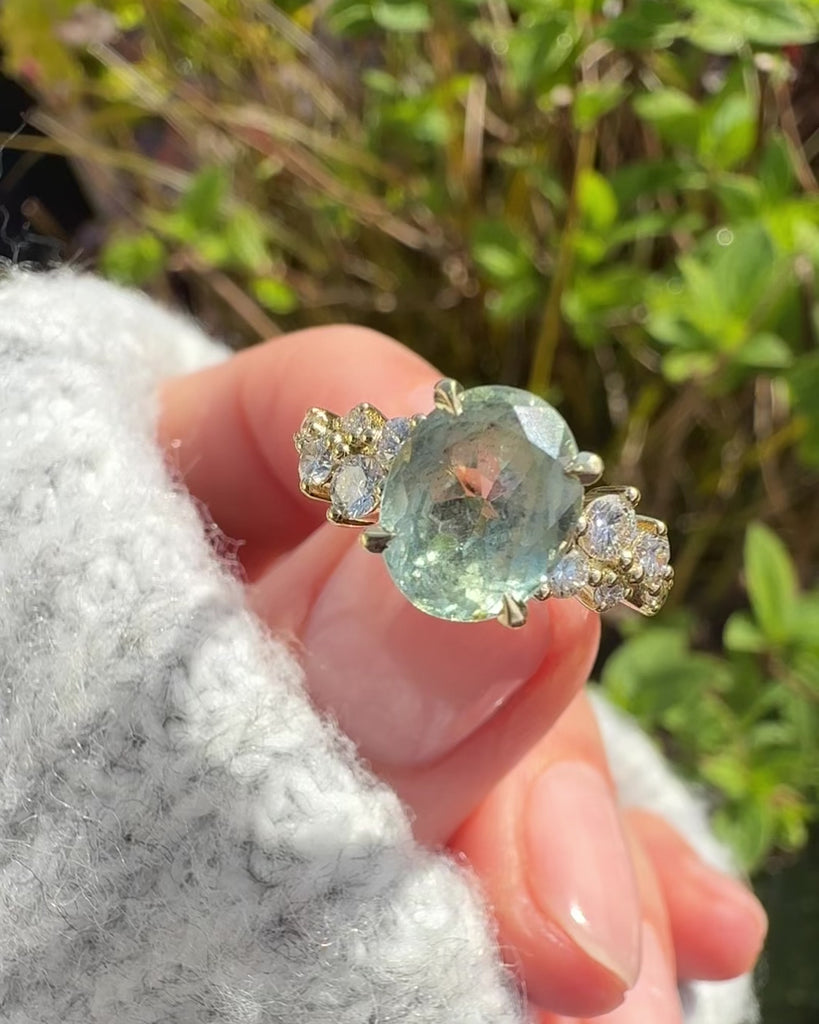 oval mint green sapphire yellow gold engagement ring