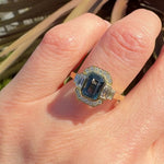 emerald cut blue sapphire one of a kind engagement ring in yellow gold