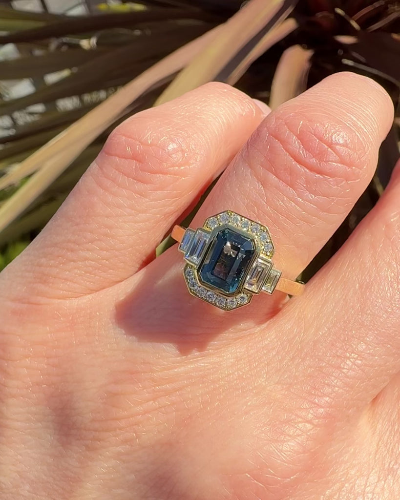 emerald cut blue sapphire one of a kind engagement ring in yellow gold