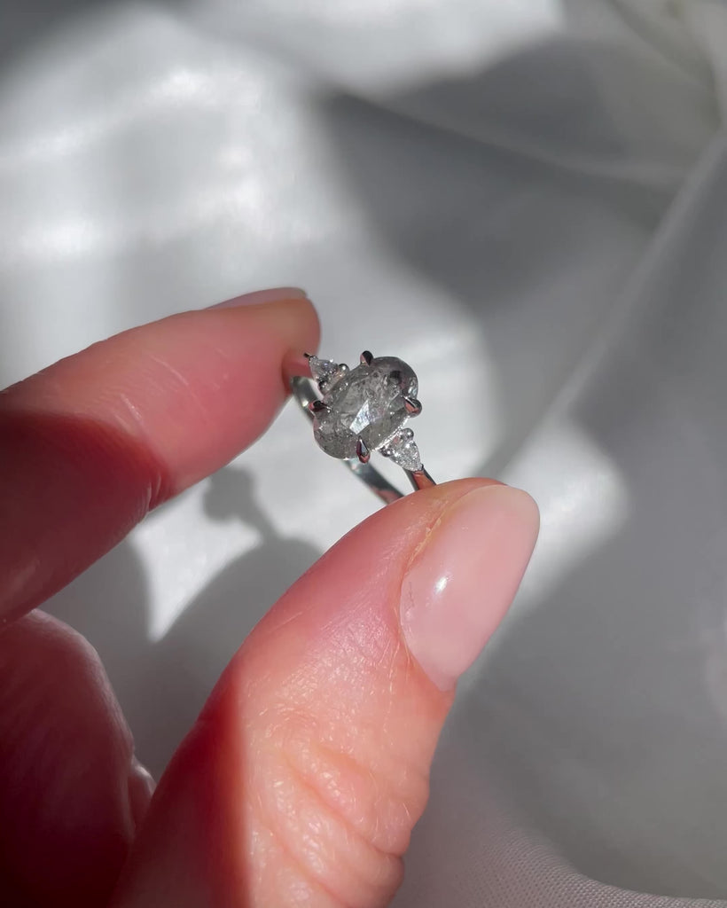 Platinum oval salt and pepper diamond trilogy