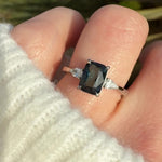 emerald cut blue teal sapphire trilogy engagement ring in platinum