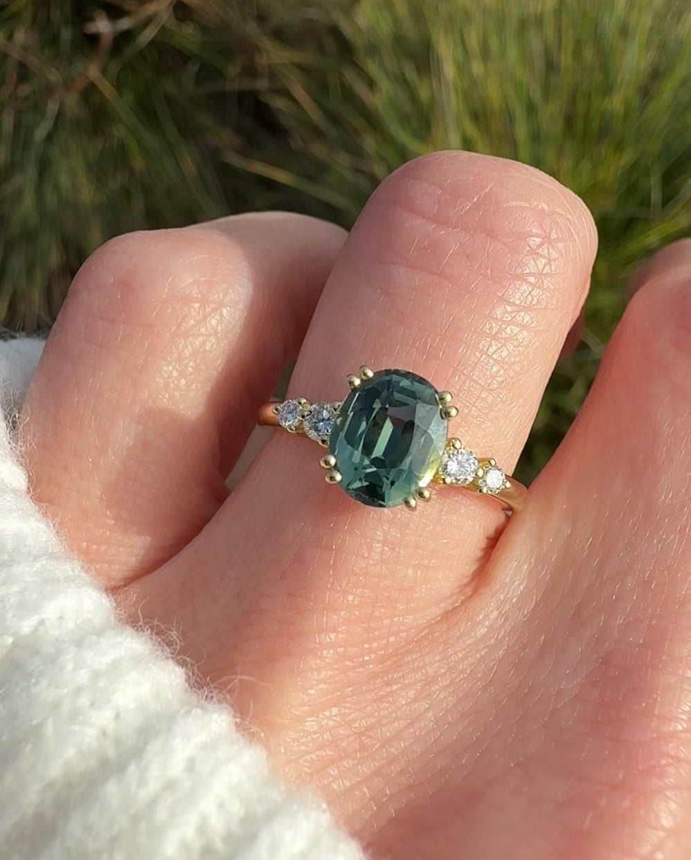 oval teal sapphire yellow gold engagement ring uk