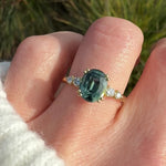 oval teal sapphire yellow gold engagement ring uk