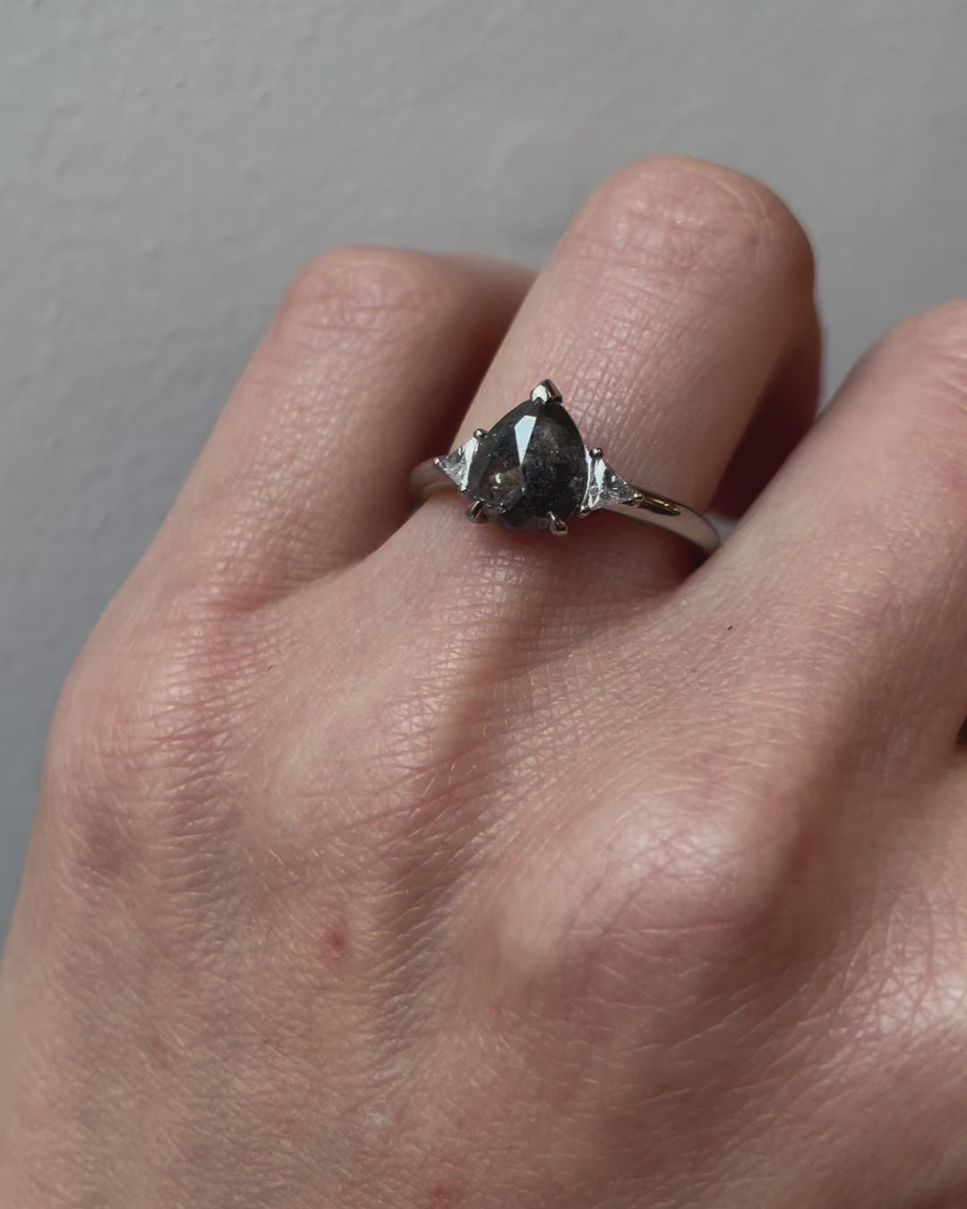 Platinum salt and pepper pear diamond engagement trilogy ring