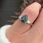 pear shape green teal sapphire trilogy engagement ring in platinum