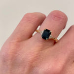 18ct yellow gold emerald cut trilogy ​teal sapphire rings
