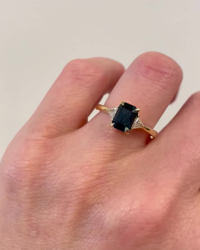 18ct yellow gold emerald cut trilogy ​teal sapphire rings
