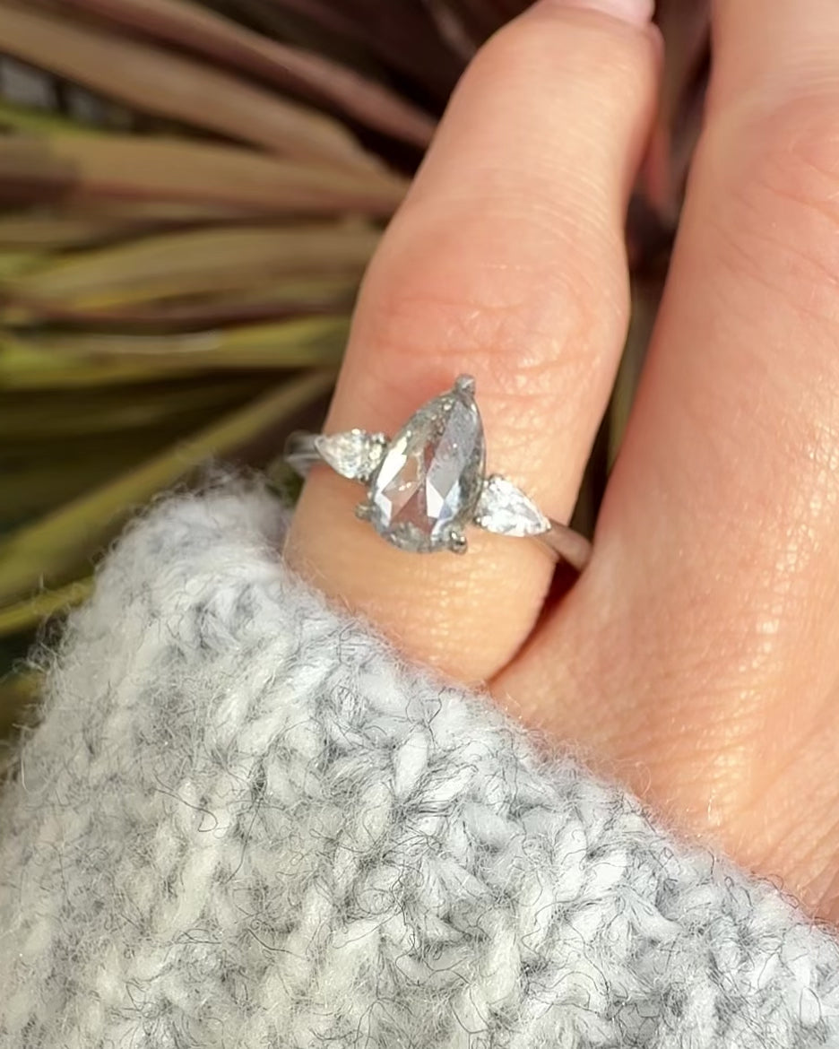 elongated pear shape salt and pepper diamond trilogy platinum engagement ring