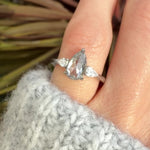 elongated pear shape salt and pepper diamond trilogy platinum engagement ring