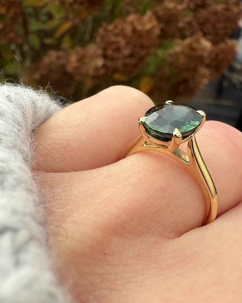 oval teal sapphire solitaire ring