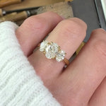 oval diamonds trilogy engagement ring set in 18ct yellow gold