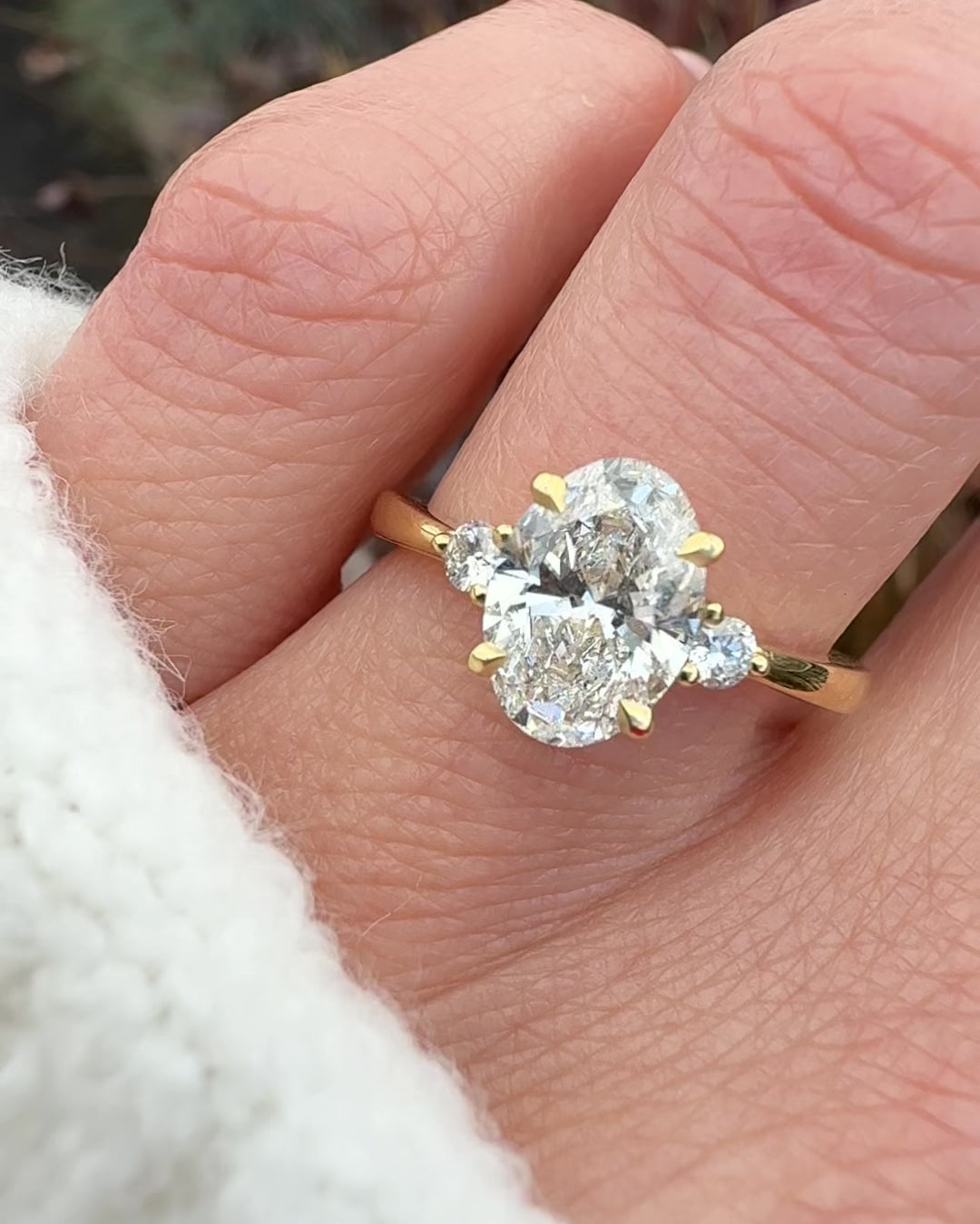 oval lab grown diamond yellow gold trilogy engagement ring