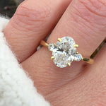oval lab grown diamond yellow gold trilogy engagement ring