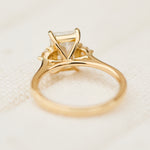 radiant cut lab grown diamond trilogy engagement ring in yellow gold