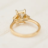 radiant cut lab grown diamond trilogy engagement ring in yellow gold