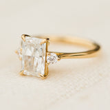 radiant cut lab grown diamond trilogy engagement ring in yellow gold