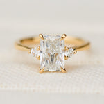 radiant cut lab grown diamond trilogy engagement ring in yellow gold