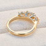 round brilliant cut lab grown diamond yellow gold trilogy engagement ring