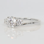 round brilliant cut lab grown diamond three stone engagement ring