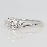 round brilliant cut lab grown diamond three stone engagement ring