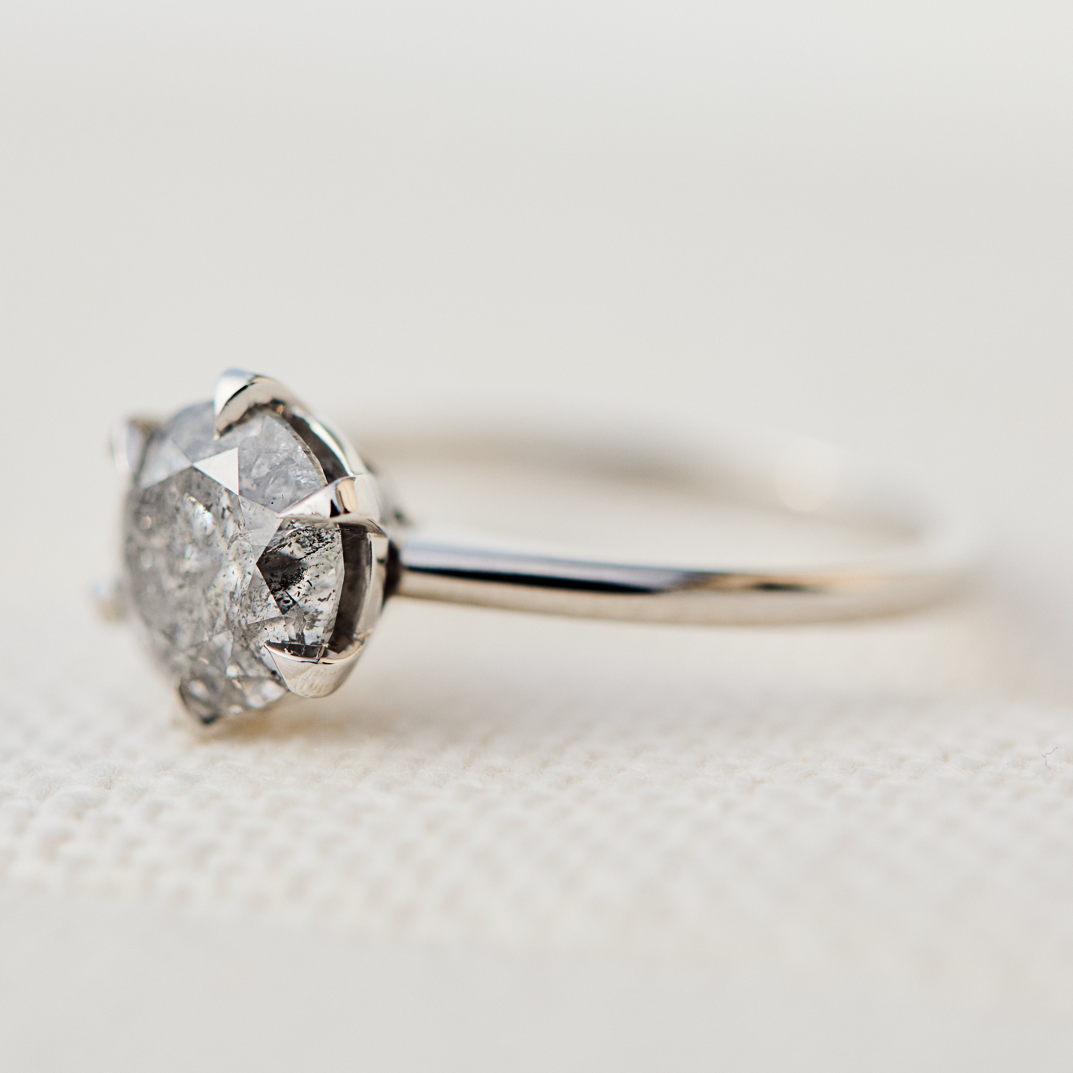 round brilliant cut salt and pepper diamond solitaire ring