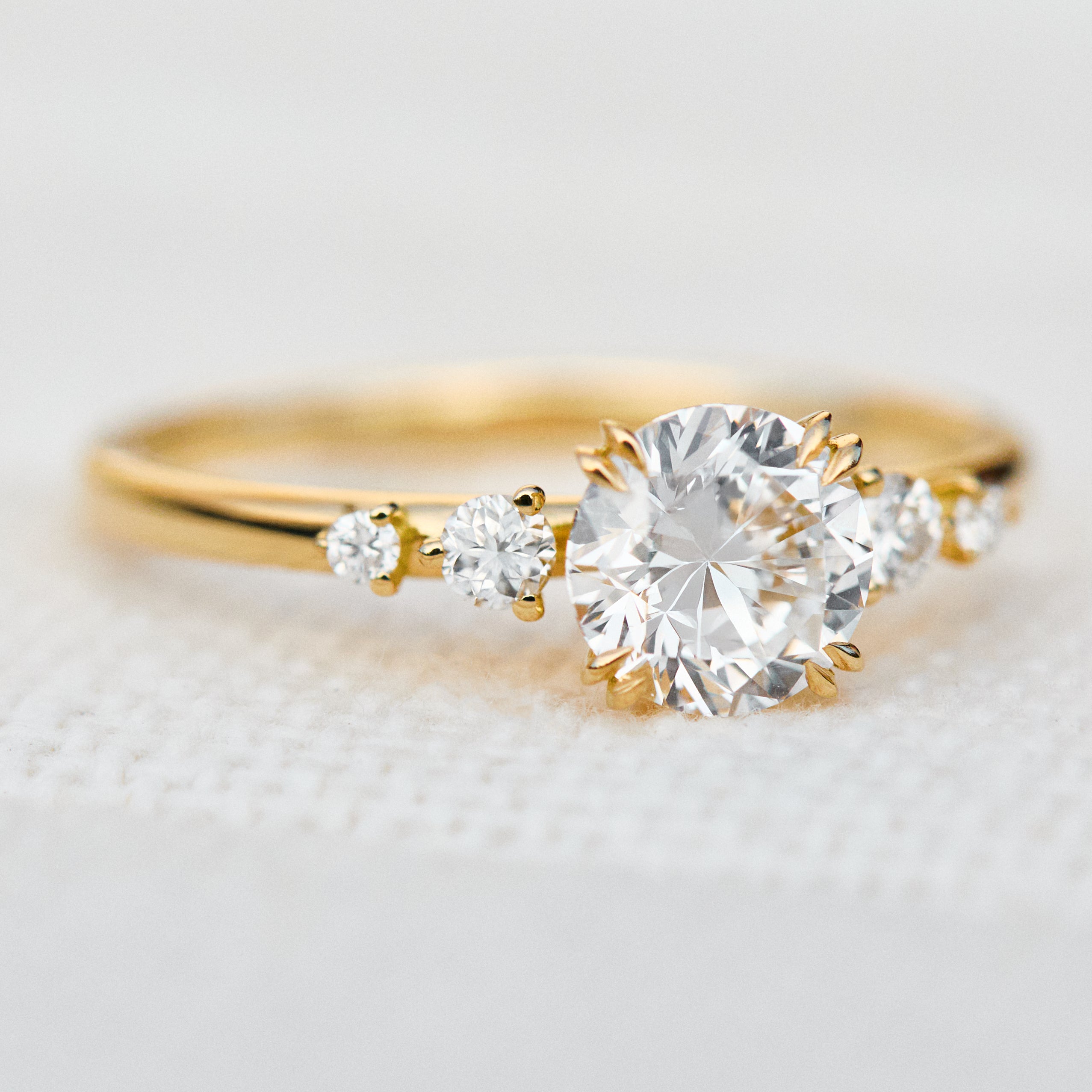 round brilliant five diamond engagement ring in yellow gold