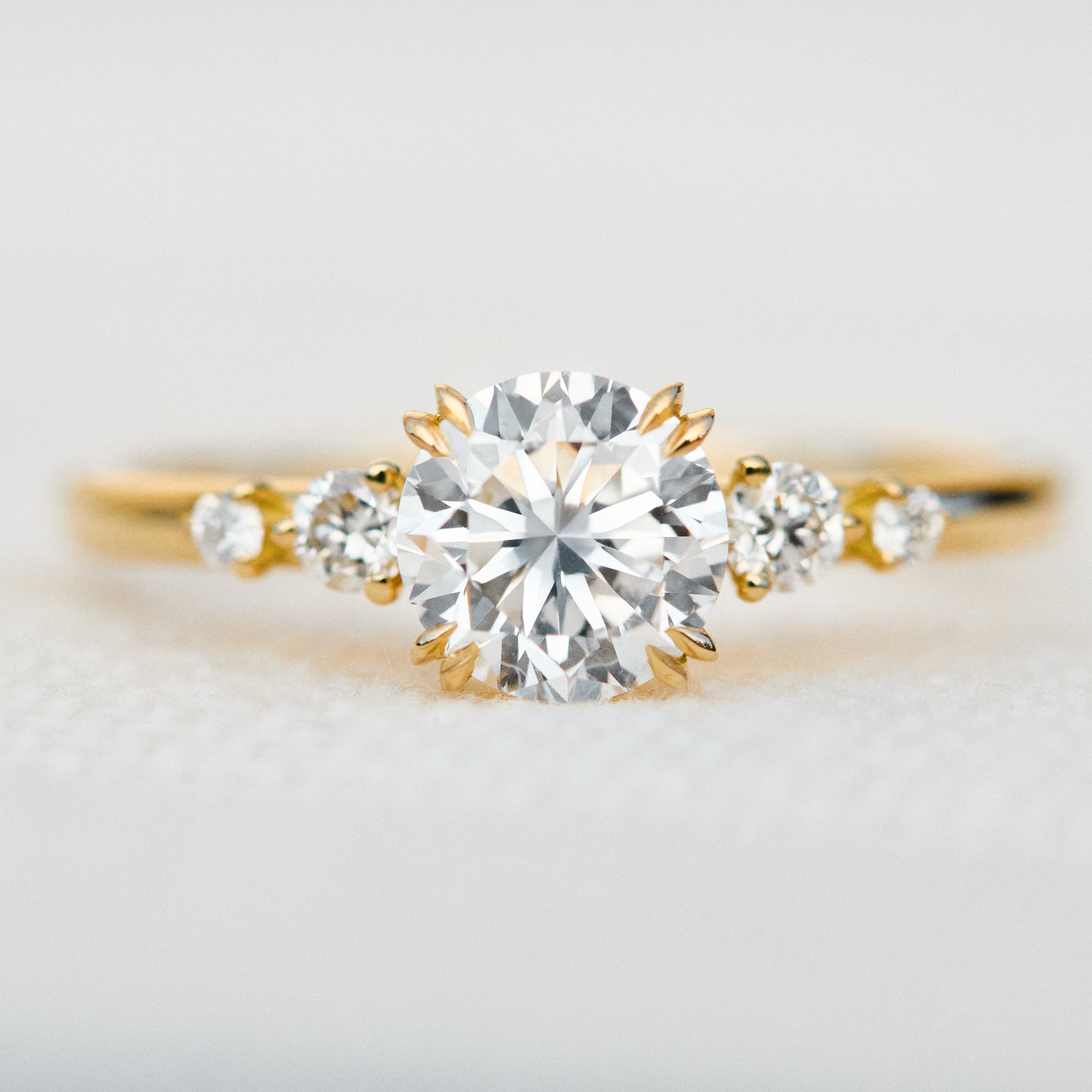 round brilliant five diamond engagement ring in yellow gold