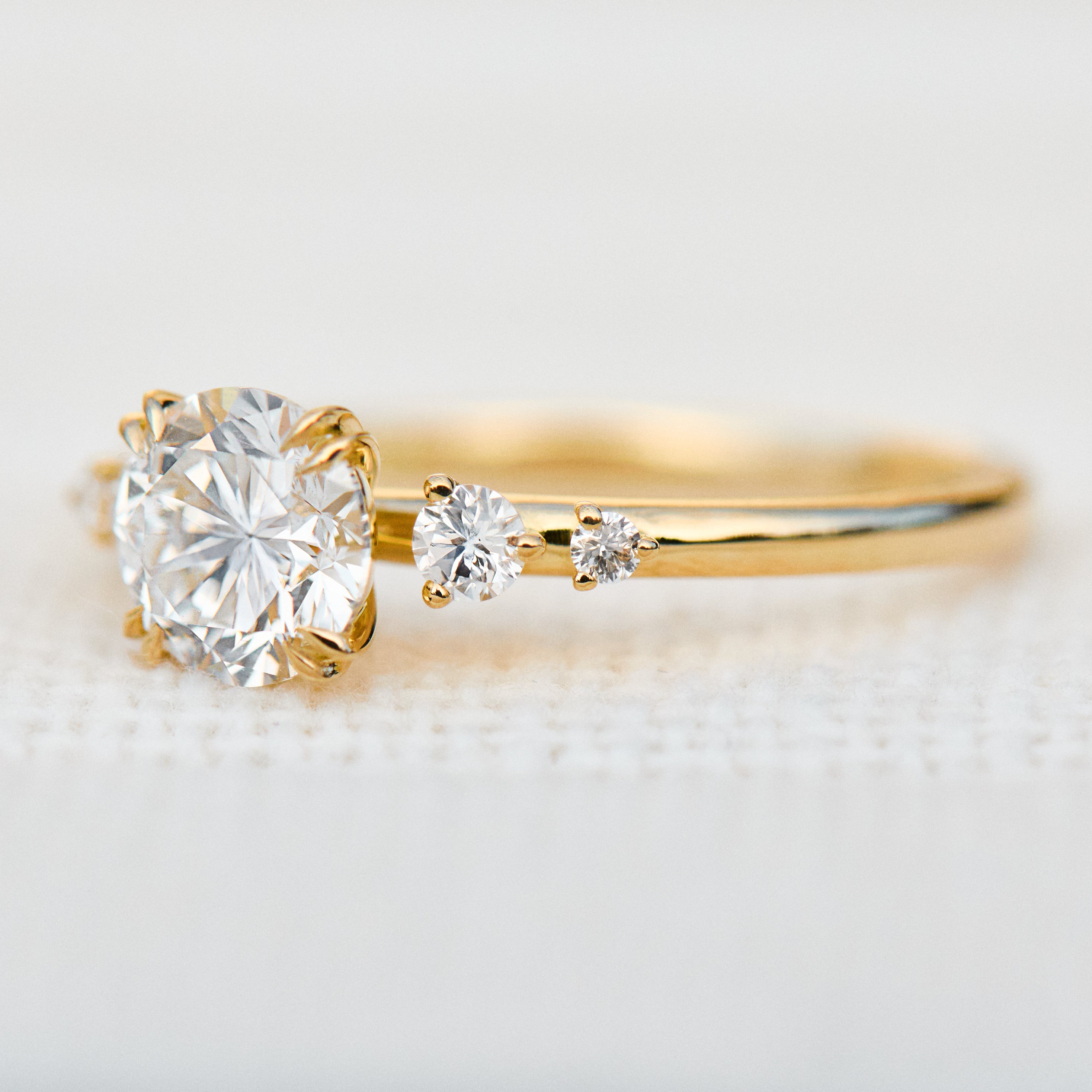 round brilliant five diamond engagement ring in yellow gold