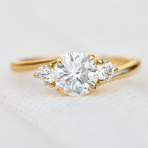 round brilliant lab grown diamond trilogy engagement ring in yellow gold