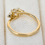 round brilliant lab grown diamond trilogy engagement ring in yellow gold