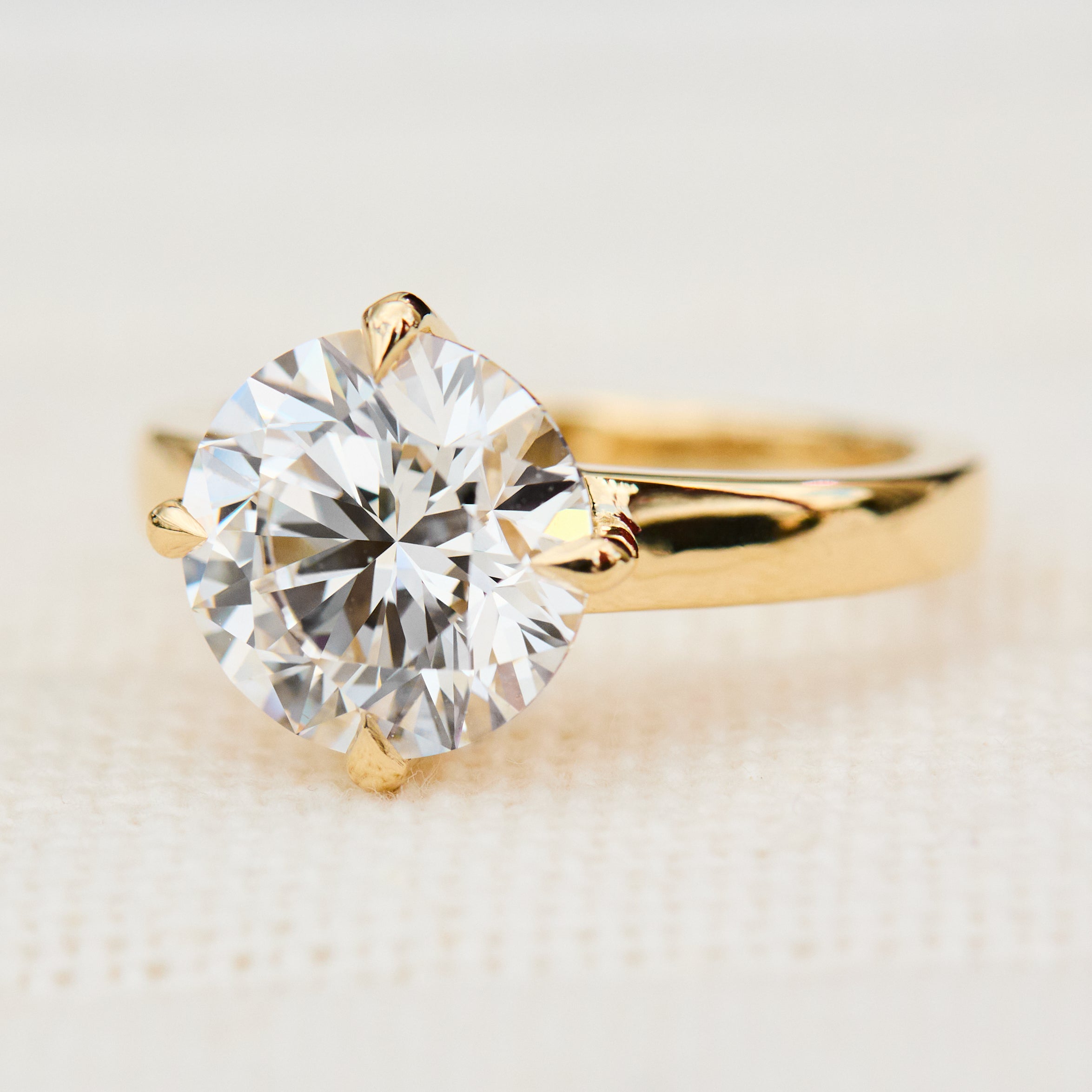 round lab grown diamond solitaire engagement ring in yellow gold