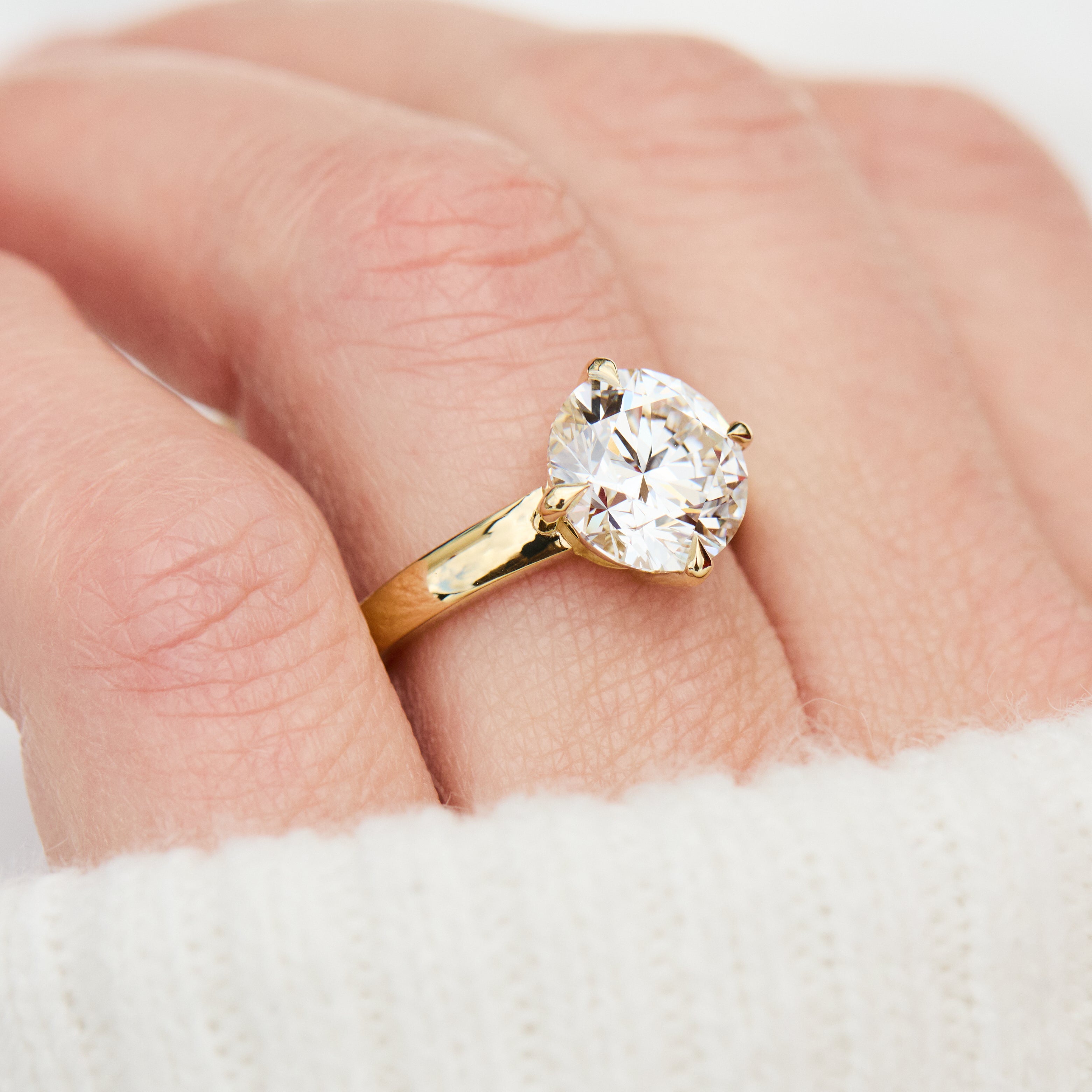 round lab grown diamond solitaire engagement ring in yellow gold