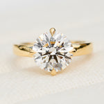 round lab grown diamond solitaire engagement ring in yellow gold