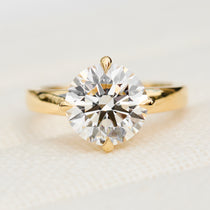 round lab grown diamond solitaire engagement ring in yellow gold