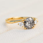 round salt and pepper diamond trilogy engagement ring in yellow gold