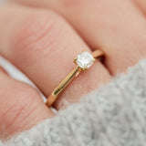 salt and pepper cushion cut diamond solitaire engagement ring in yellow gold