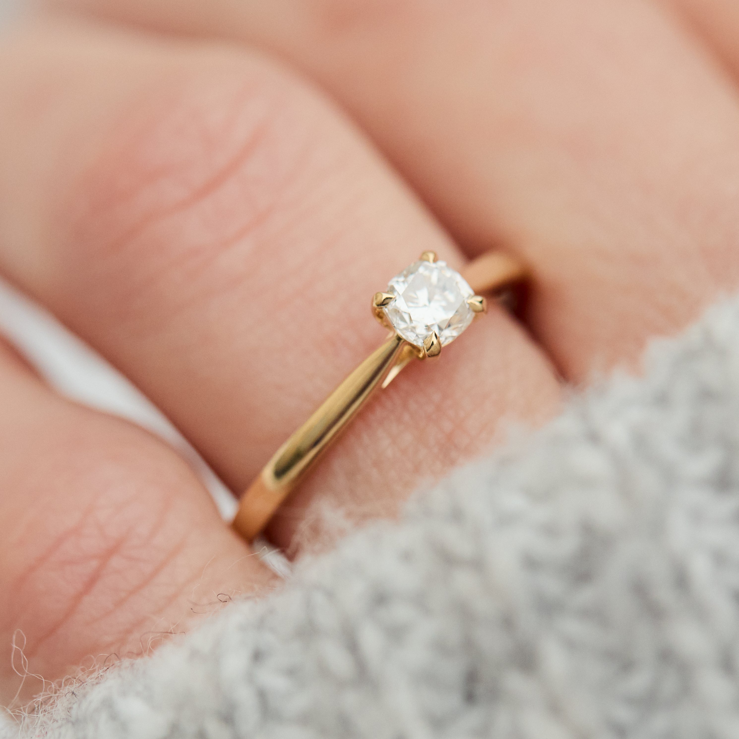 salt and pepper cushion cut diamond solitaire engagement ring in yellow gold