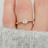 salt and pepper cushion cut diamond solitaire engagement ring in yellow gold