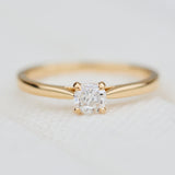 salt and pepper cushion cut diamond solitaire engagement ring in yellow gold