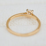 salt and pepper cushion cut diamond solitaire engagement ring in yellow gold