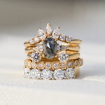 salt and pepper diamond stack featuring yellow gold engagement and wedding rings