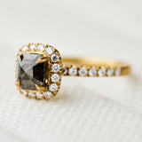 salt and pepper halo engagement ring in yellow gold