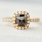 salt and pepper halo engagement ring in yellow gold