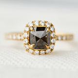 salt and pepper halo engagement ring in yellow gold