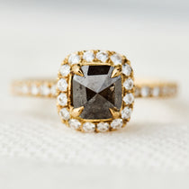 salt and pepper halo engagement ring in yellow gold