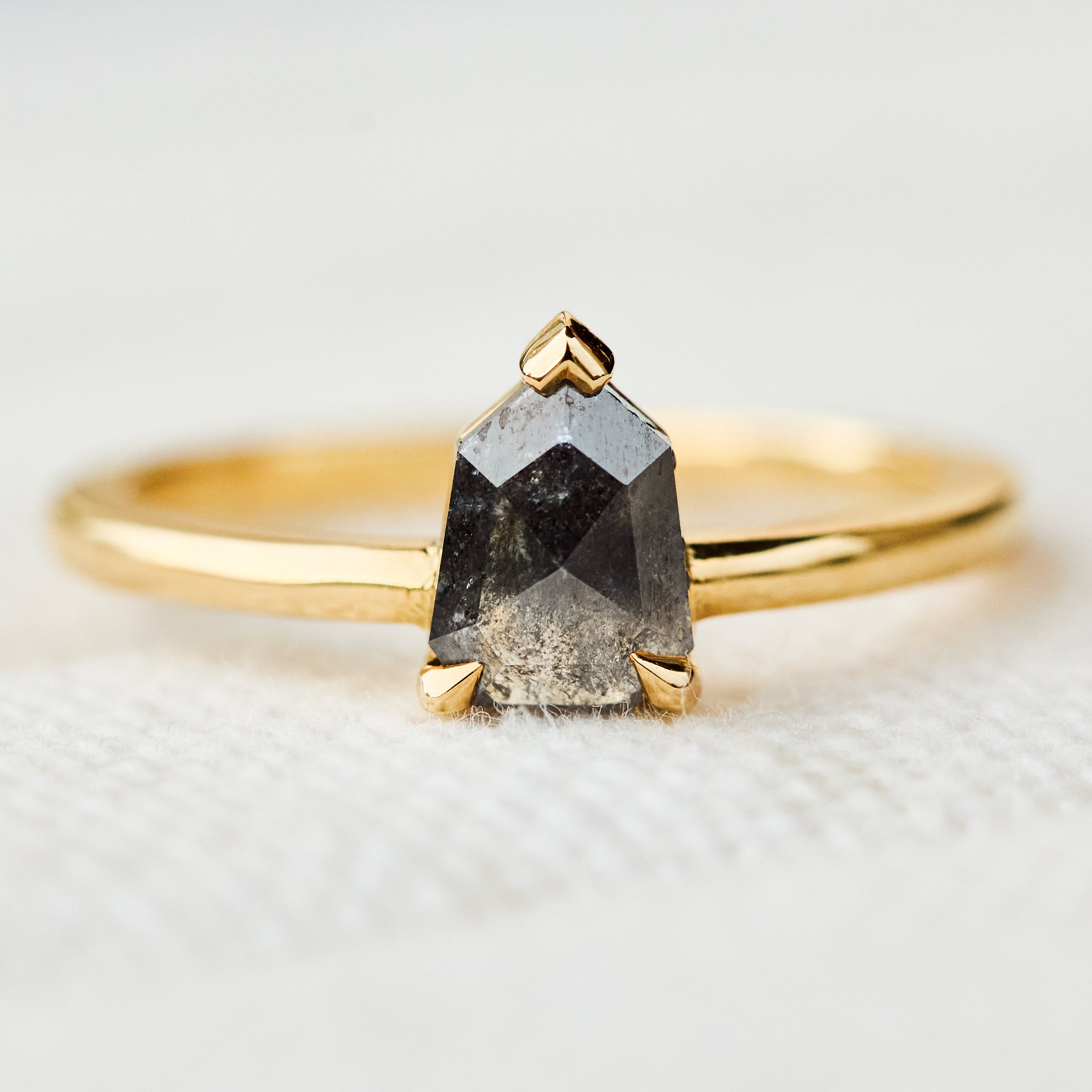 salt and pepper shield shape solitaire diamond ring in yellow gold