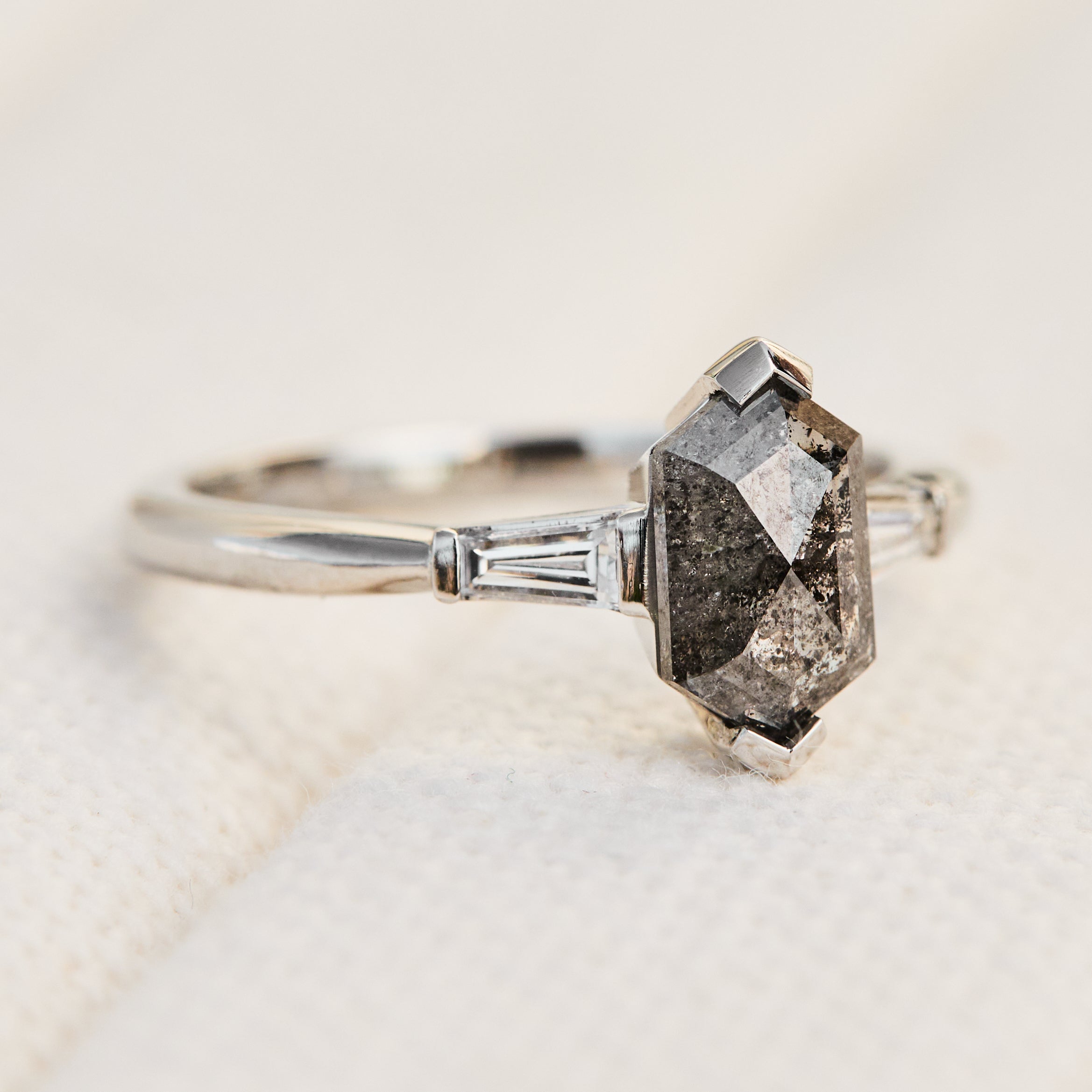 elongated hexagon salt and pepper diamond trilogy engagement ring