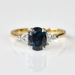 oval blue sapphire yellow gold