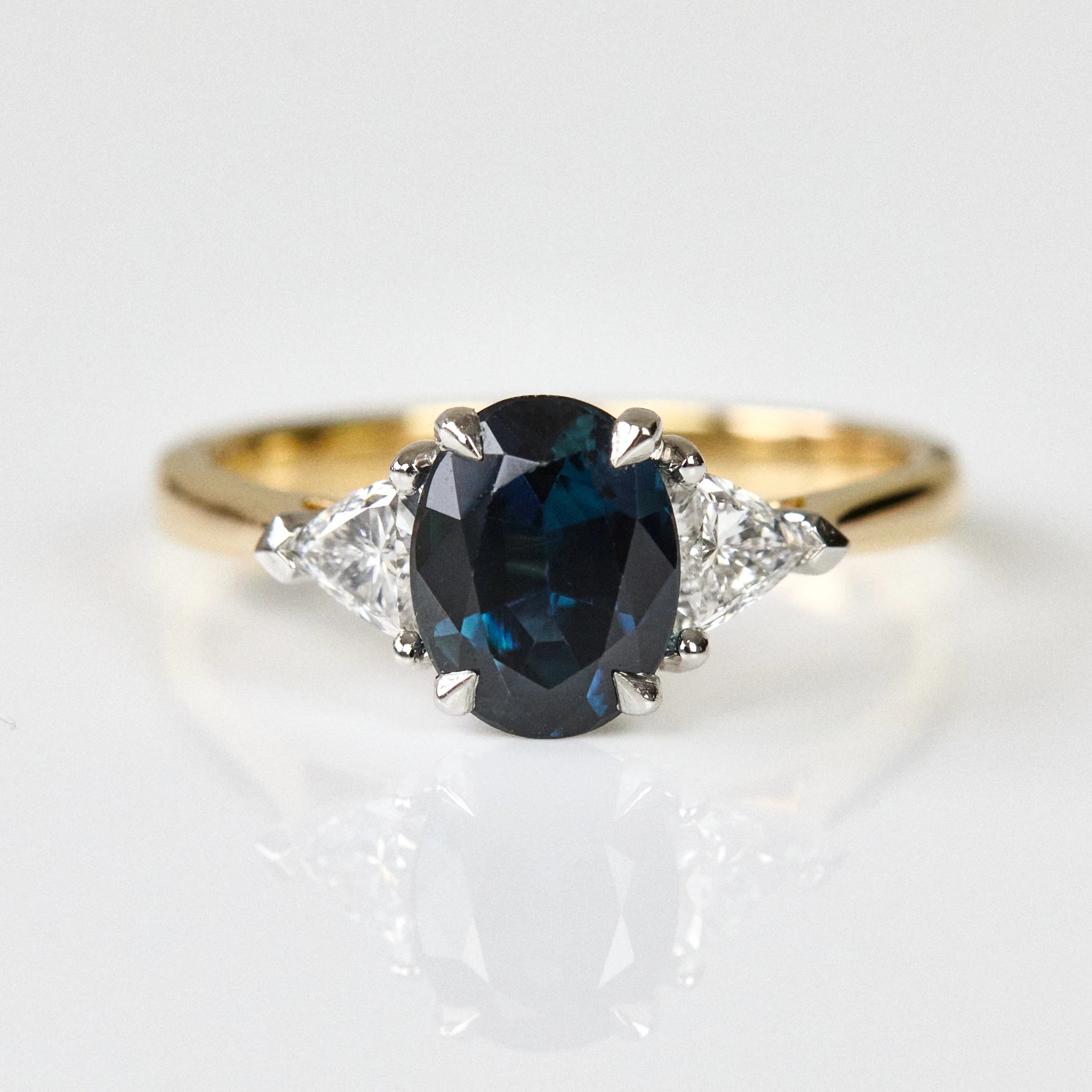 oval blue sapphire yellow gold